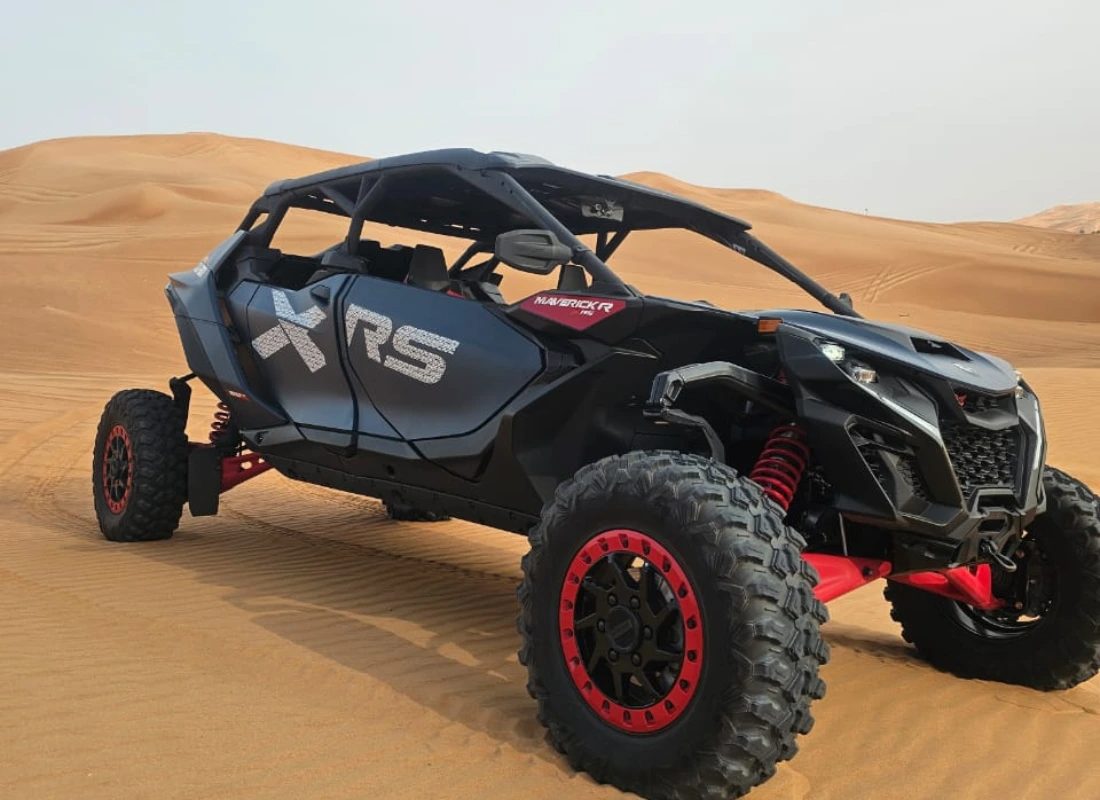 4x4 dune bashing across the red dunes on a Dubai desert safari at sunset