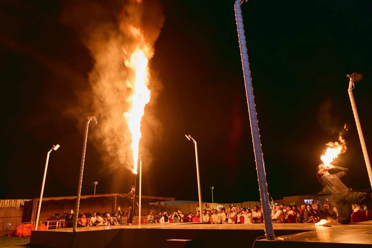 Live fire show performance at a desert safari camp at night